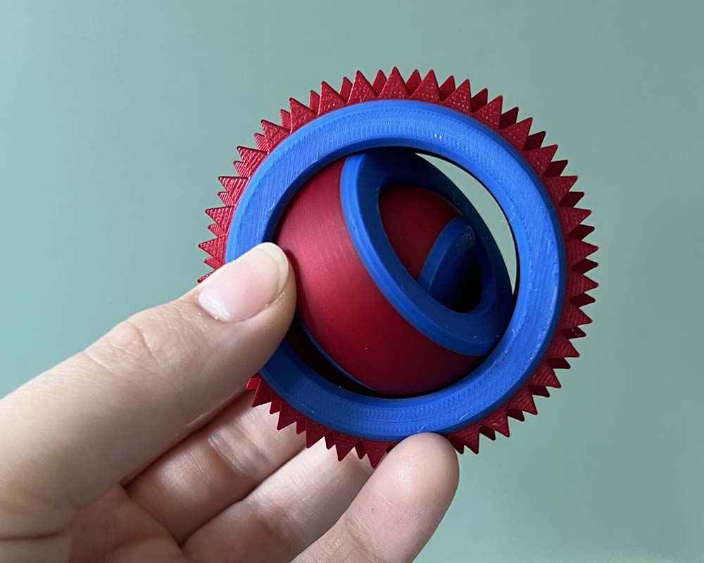Spinning figet toy with pain stim spikes on outer edge, 3 tiered spinning fidget toy