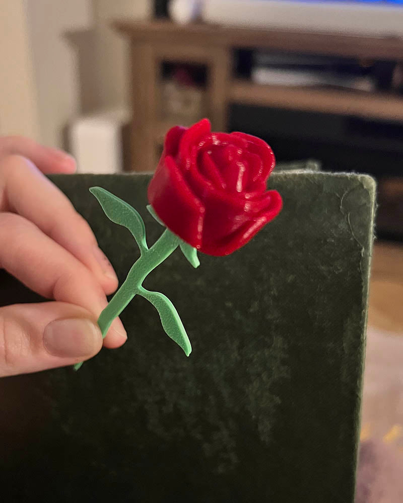 3D printed rose bookmark with detailed flower and thorn stem, Floral book accessory with a 3D rose peeking out of a book, Handmade rose bookmark gift for readers and book lovers