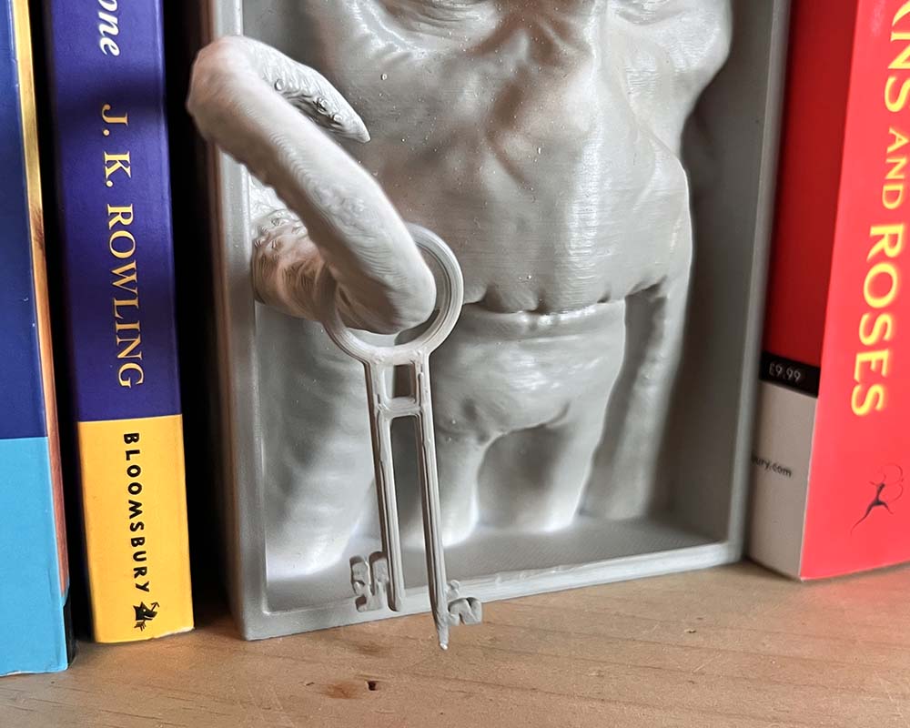 Pirates of the Caribbean inspired nautical shelf decor close up of Davy Jones key