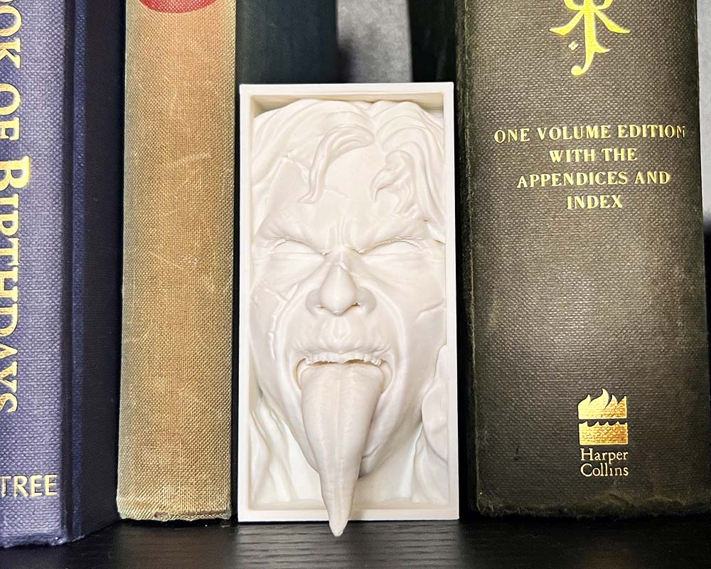 Exorcist book nook with possessed girl tongue out 3D printed horror shelf insert inspired by The Exorcist Gothic bookshelf decor featuring Exorcist possession sceneHorror movie book nook gift for collectors Demonic tongue-out figure book nook for horror fans
