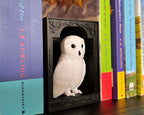 Decorative book nook featuring Hedwig the owl