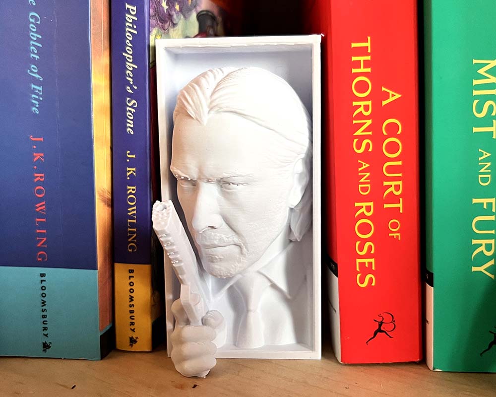 Close-up of Baba Yaga’s face and raised pistol on shelf insert