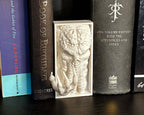 Mind Flayer figure between books for tabletop gamers