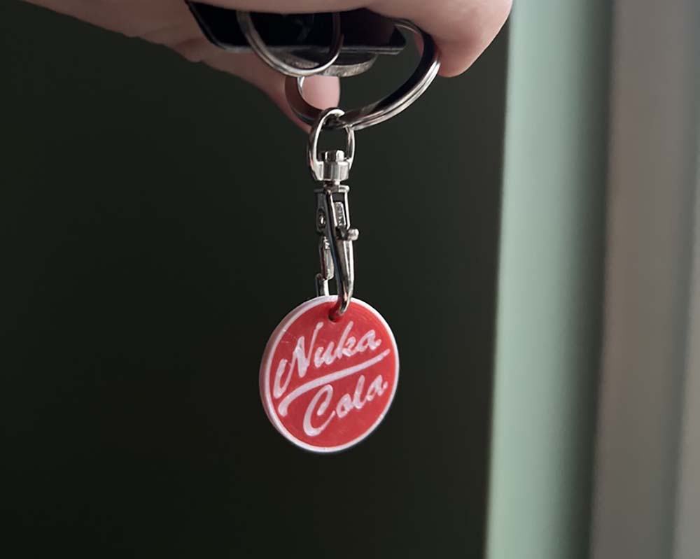 Nuka Cola-Inspired Trolley Token Keyring – Fallout-Style Red Coin for On-the-Go Shopping