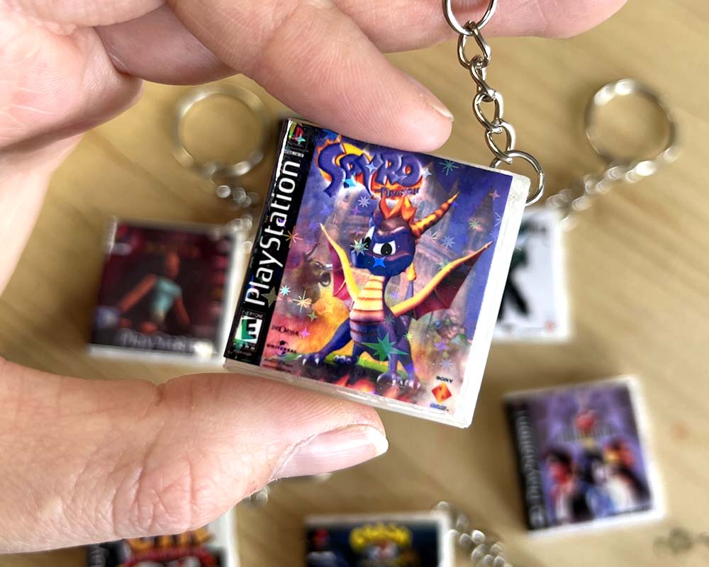 Miniature spyro PS1 game case keyring retro PlayStation design, stocking filler gift for playstation 1 gaming fans