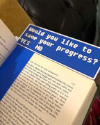 Book with a blue sign asking 'Would you like to save your progress?'