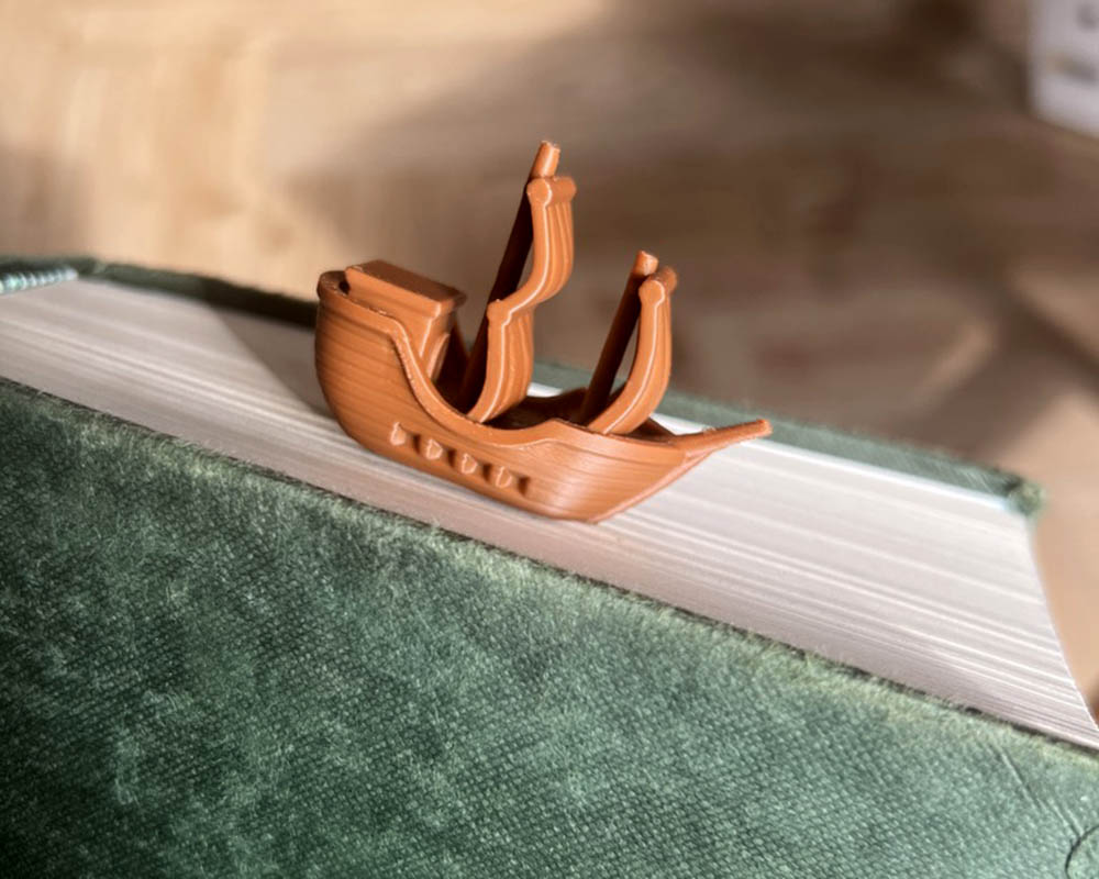 Shark attack bookmark with 3D printed ship design Ocean fantasy bookmark for readers and book lovers Shark bite page holder nautical book accessory Quirky 3D printed shark and ship bookmark gift Unique bookmark for pirate and sea monster fans
