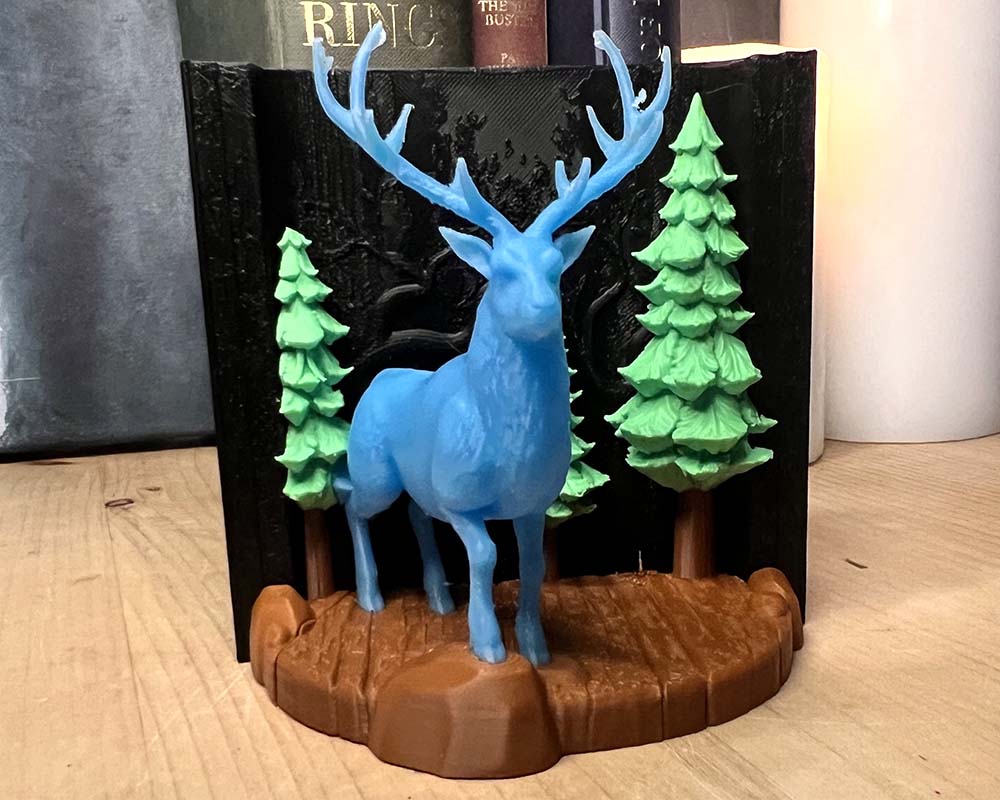3D printed Stag Patronus book nook with mystical forest backdrop – Harry Potter-inspired bookshelf décor, handmade in the UK.