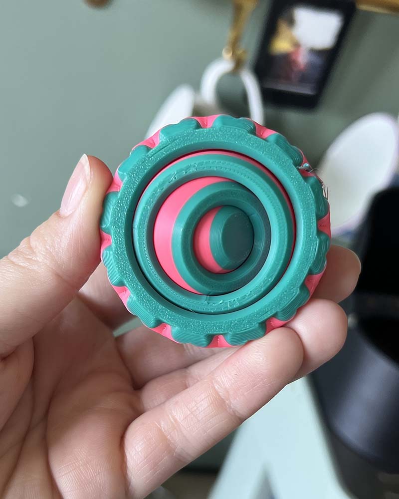 gyro spining fidget toy with textured edges colourful sustainable plastic 3d printed stim toys