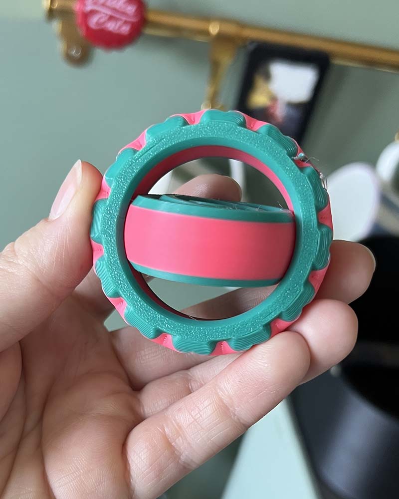 gyro spining fidget toy with textured edges colourful sustainable plastic 3d printed stim toys