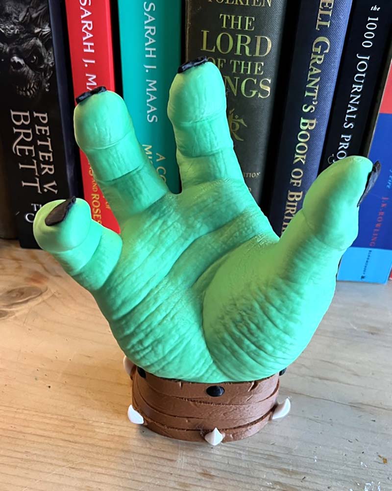 Fantasy gaming controller stand with detailed orc sculpture