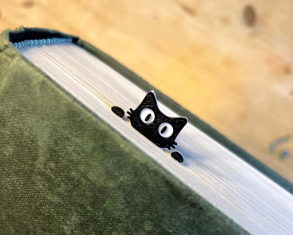 Close-up of cat face on peeking bookmark 3d printed tab like bookmark