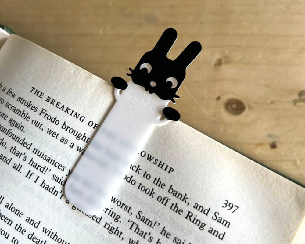 Black and white rabbit bookmark minimalist 3D design Cute bunny bookmark peeking out of book pages 3D printed rabbit page holder for book lovers